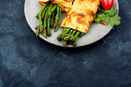 Delicious omelette with asparagus, healthy food.