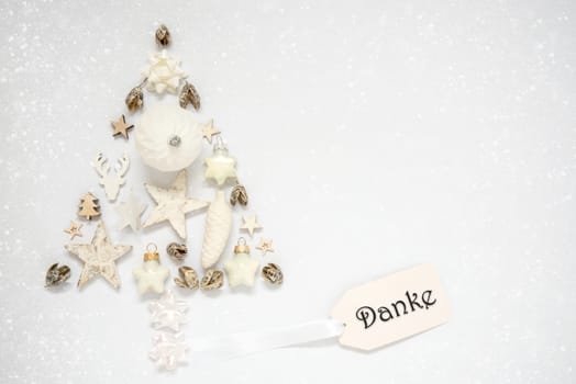 Whiter Background With A Christmas Tree Out Of Christmas Decoration, With A Label With German Text Danke, Which Means Tnaks In English