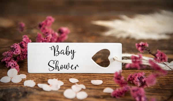 Natural Background With Purple Blossoms and Label With the English Word Baby Shower, Summer or Autumn Decoration