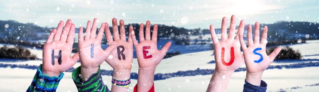 Children Hands Building Colorful English Word Hire Us. White Winter Background With Snowflakes And Snowy Landscape.