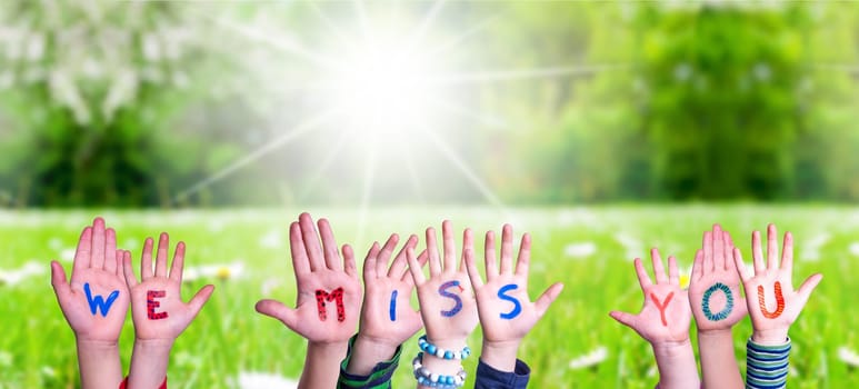 Children Hands Building Colorful English Word We Miss You. Summer, Sunny Green Grass Meadow As Background