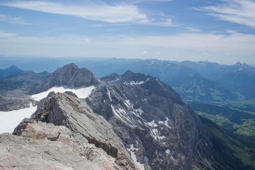 Panorama of massive Alpine mountains. Landscape in the Austrian Alps of the Dachstein region (Styria in Austria) - view from Dachstein