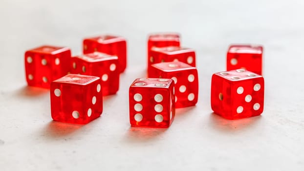 Red craps dices on white board showing different numbers.