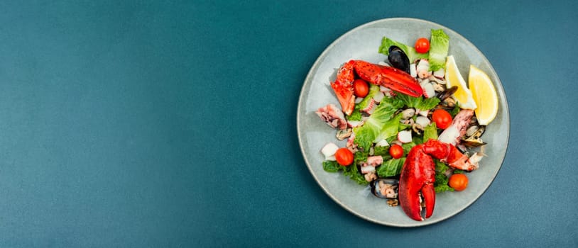 Appetizing salad of oysters, mussels, lobster and vegetables. Ketogenic