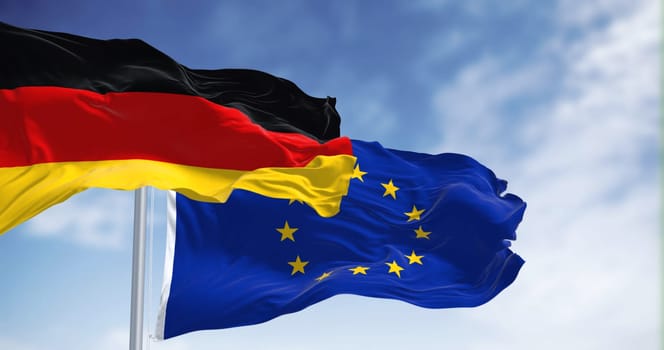 Flags of Germany and the European Union waving in the wind on a clear day. Germany became a member of the EU in january 1958. 3d illustration render. Fluttering fabric