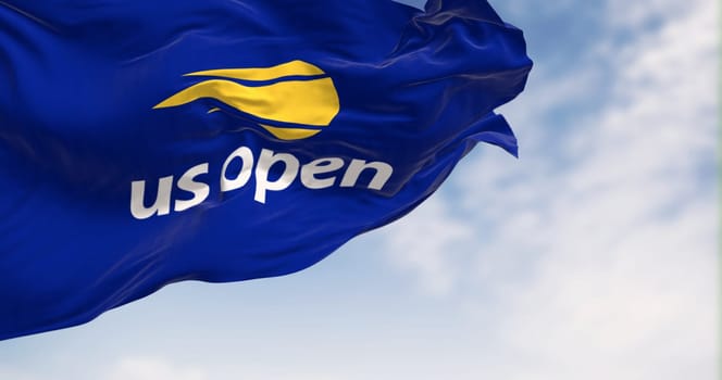 New York, US, July 2 2023: Us Open flag waving on a clear day. Major tennis tournament held annually in New York. Grand Slam event. Illustrative editorial 3d illustration render