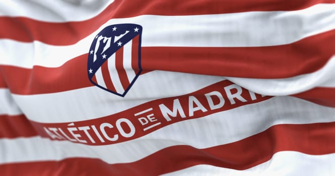 Madrid, Spain, Aug. 1 2023: Close-up of Atletico Madrid waving in the wind. Spanish professional football club based in Madrid. Illustrative editorial 3d illustration render. Selective focus