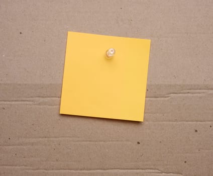 Yellow paper blank stickers attached with a button, space for notes and labels