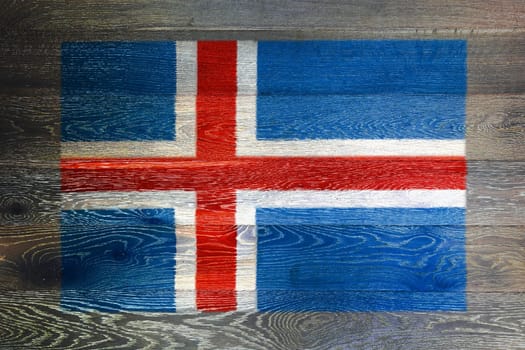 An Iceland flag on rustic old wood surface background