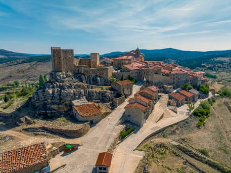 Puertomingalvo province of Teruel listed as beautiful towns of Spain  Front panoramic aerial view entrance and castle
