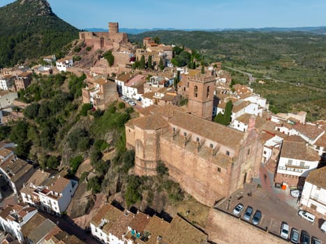 Aerial panoramic view of Vilafames in Castellon listed as beautiful towns of Spain. Foreground the Church of the Assumption