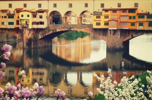 famous bridge Ponte Vecchio close up over river Arno at spring, Florence, Italy, retro toned