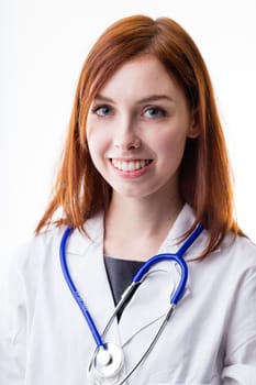 gentle doctor is a red hair big blue eyes woman smiling at you before cutting your paunch and using a big syringe