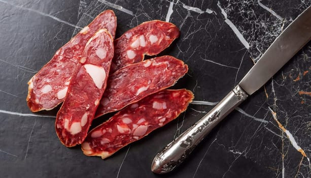Horse meat sausage with tomatoes and herbs
