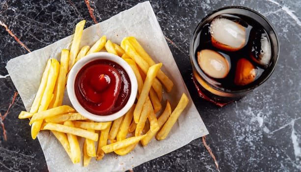 plate of french fries on a wooden table