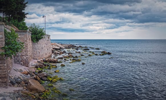 Beautiful seascape with view to the Nesebar stone walls on the coast. Bulgarian coastline of the Black Sea