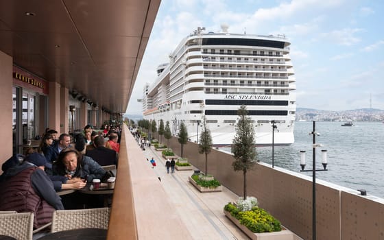 Istanbul, Turkey - May 5, 2023: MSC SPLENDIDA, Large cruise ship docked at terminal of Galataport, a mixed use development located along shore of Bosphorus strait, in Karakoy neighbourhood