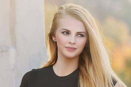 Portrait of seductive long haired young girl closeup. Horizontally.