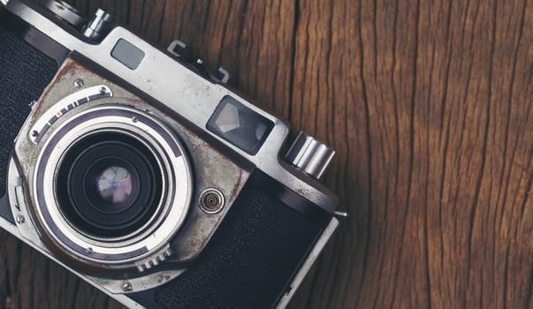 vintage old film camera on wood board with copy space