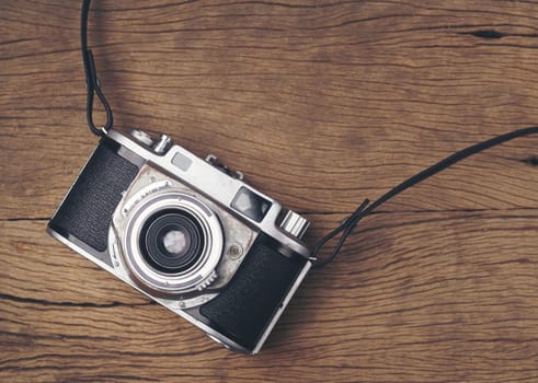 vintage old film camera on wood board with copy space