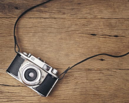 vintage old film camera on wood board with copy space