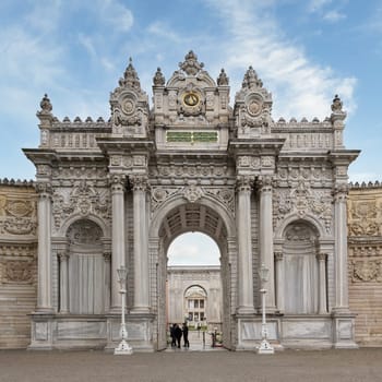 Istanbul, Turkey - May 10, 2023: Entrance of Dolmabahce Palace, with tourists visiting the place - View from the inner courtyard