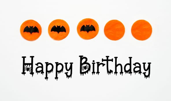White Halloween Background With Orange Dots And Black Bats And Text Happy Birthday