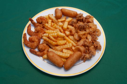 seafood delicacy known as fried calamari rings and shrimp