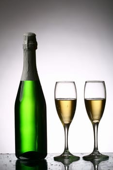 champagne with grape and the green bottle