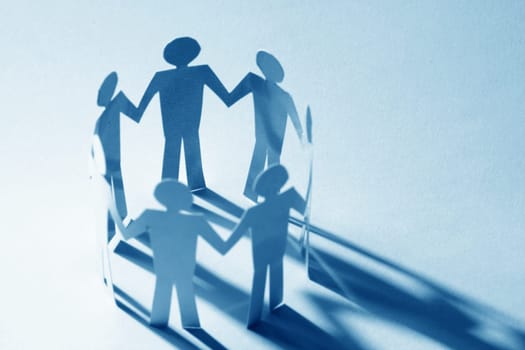 paper team linked together partnership concept