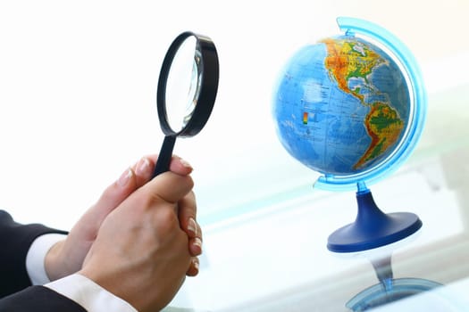 looking on earth globe where to travel