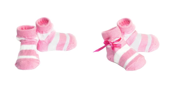 Pink babys socks on a white background
