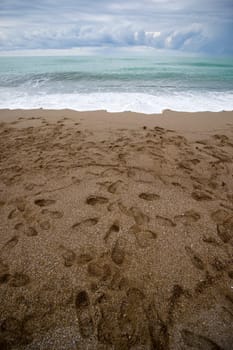 Footsteps on the beach. The Mediterranean Sea, Turkey. aRGB.