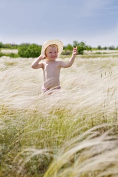small girl in feather-grass