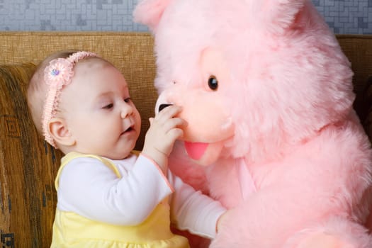 small girl with big toy bear