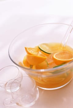 Goblet of orange juice with two glasses