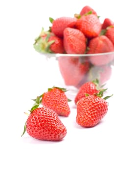 strawberries in the bowl closeup on white background