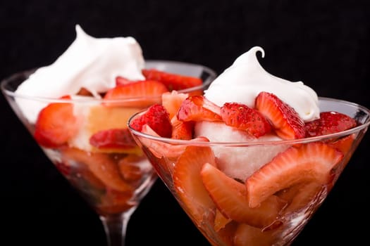 Strawberry shortcake in a martini glass sponge cake and whip cream