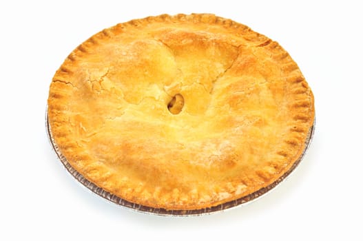 Whole apple pie isolated on white background