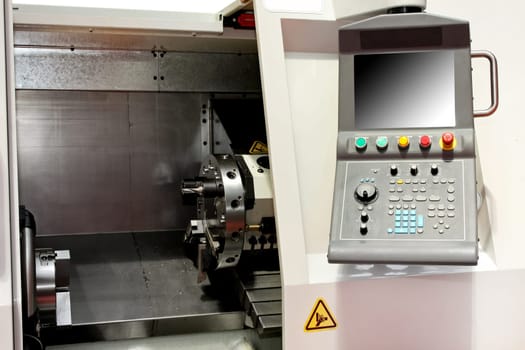 Close up shot of automatic lathe machine