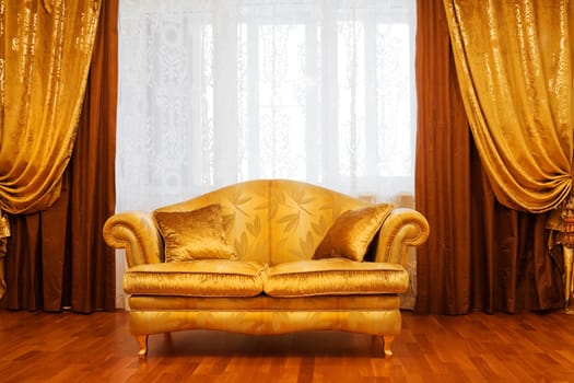 Beautiful sofa at a window in a modern apartment