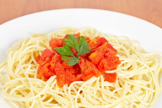 Freshly cooked plate of spaghetti with tomato sauce just for eating. Shallow depth of field