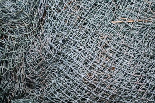 Close up of gray industrial fishing net background