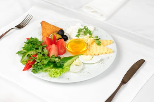 light healthy breakfast served on white tablecloth