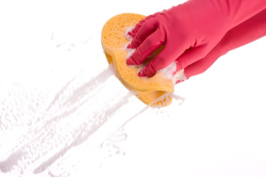 pink hand cleaning a mirror