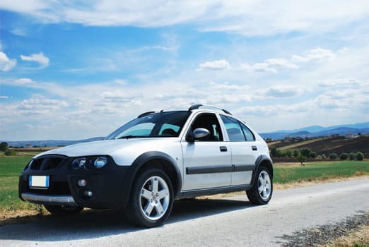 Modern car at the side of a rural road