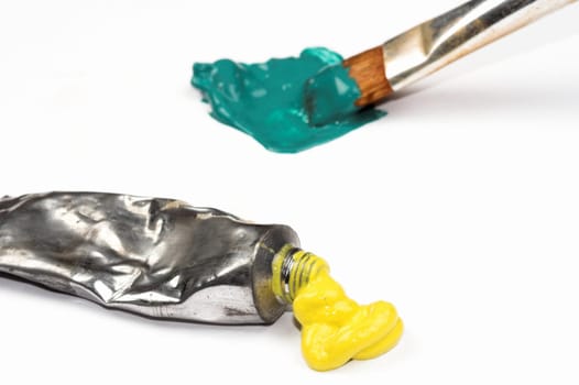 brush , yellow and green paints