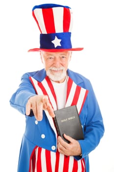 American icon Uncle Sam holding a bible and pointing at you.  Isolated on white.