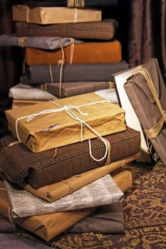 Big stack of gifts wrapped in recycled paper