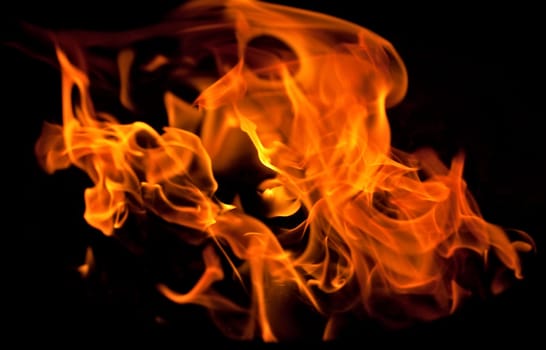 flames from a fire in the grill